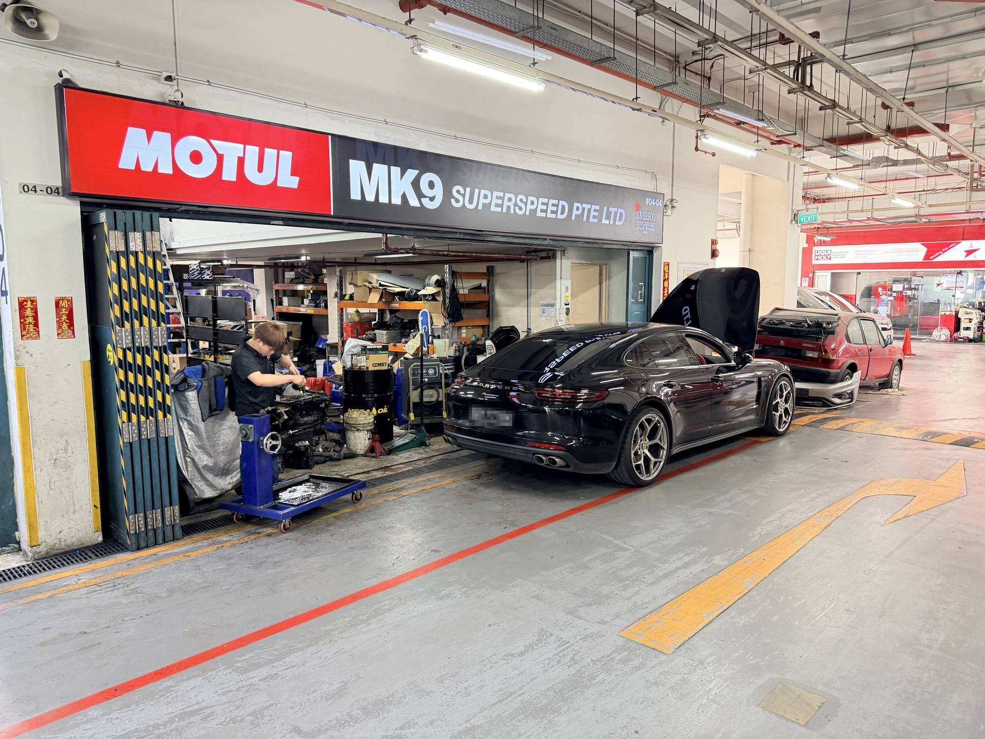MK9 Superspeed storefront with a Porsche Panamera in the bay