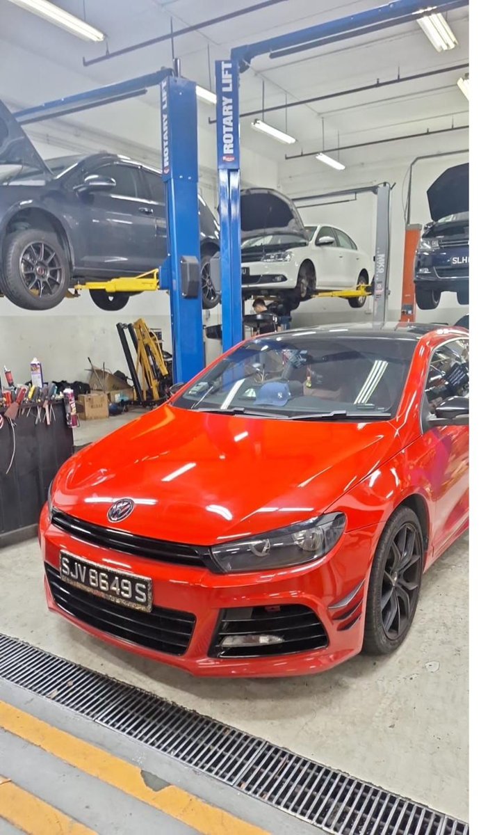 Red Volkswagen Scirocco at the workshop